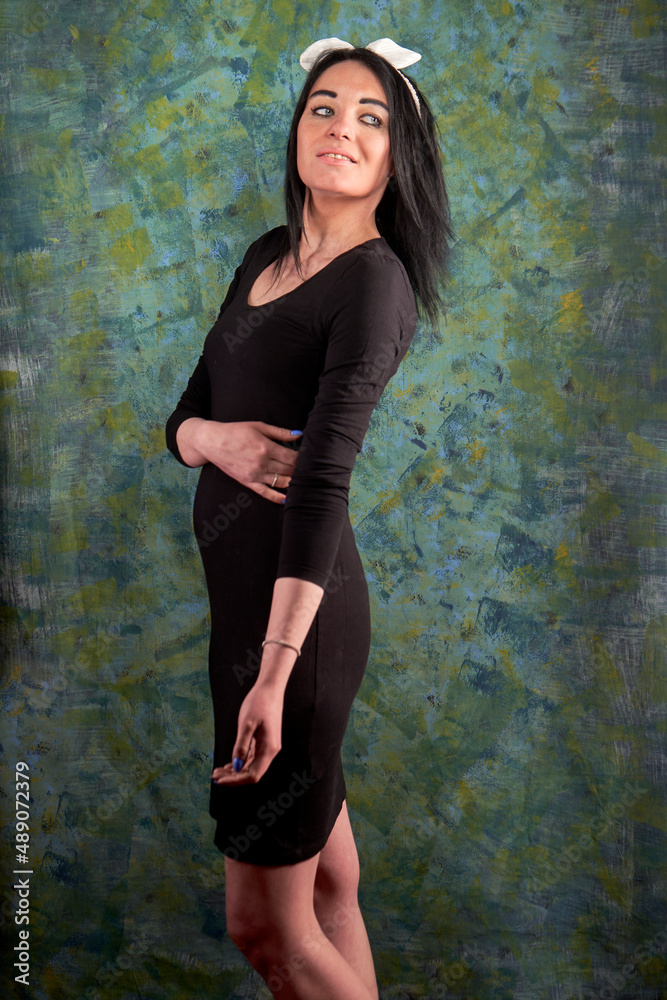 Fototapeta premium Brunette girl and black dress
