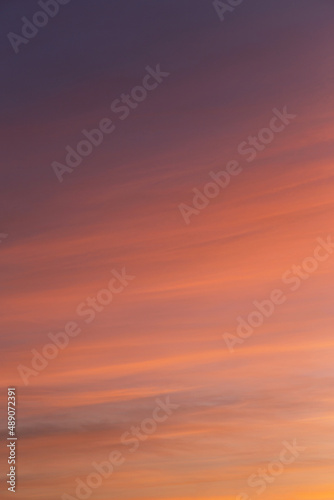 Beautiful soft sunrise, sunset yellow orange blue sky with cirrus clouds abstract background texture  © Viktor Iden