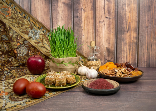 Festive table in honor of Navruz. Wheat with a red ribbon, the traditional holiday of the vernal equinox Nawruz photo