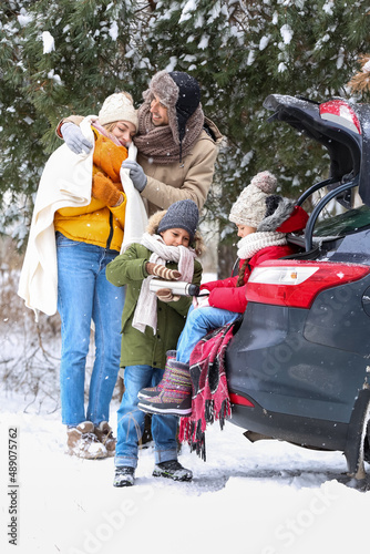 Happy family with thermos d...