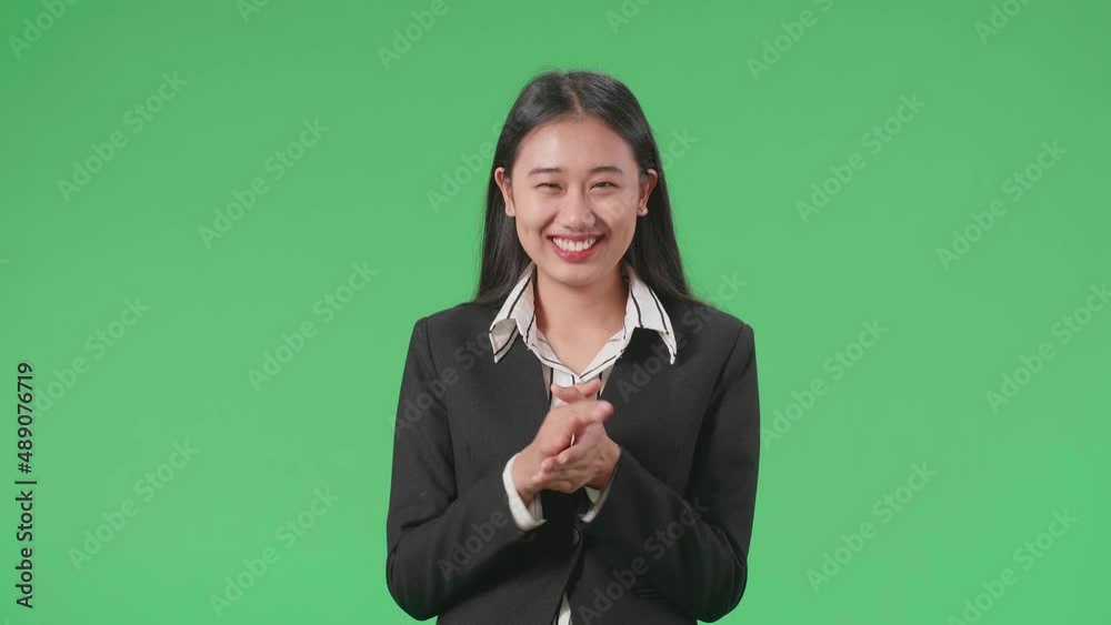 An Asian Business Woman Clapping Her Hands In The Green Screen Studio
An Asian Business Woman Clapping Her Hands In The Green Screen Studio