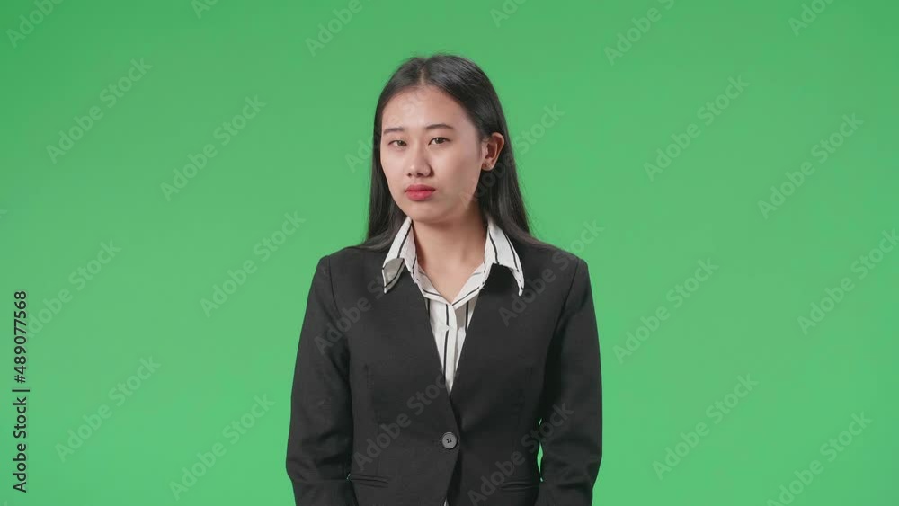 A Terrible Asian Business Woman Looking At Camera In The Green Screen Studio
A Terrible Asian Business Woman Looking At Camera In The Green Screen Studio