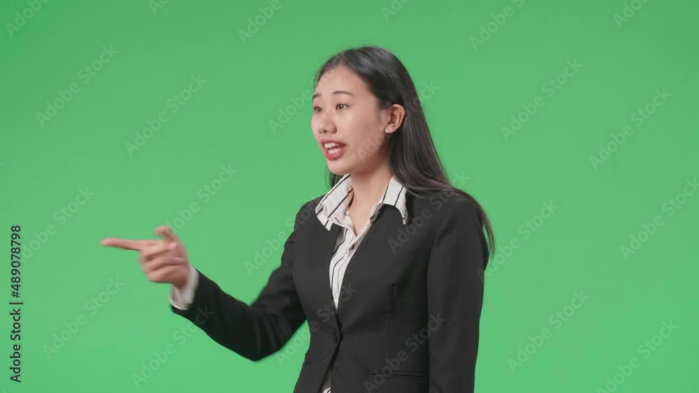 Side View Of An Angry Asian Business Woman Scolding While Standing On Green Screen In The Studio
Side View Of An Angry Asian Business Woman Scolding While Standing On Green Screen In The Studio