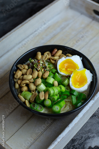 lunch in home office: asian bowl with an egg. High-quality photo