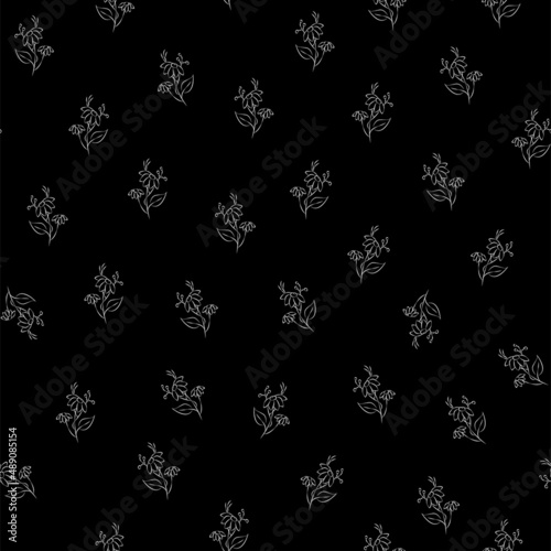 Vector black and white illustration. Floral seamless pattern. Bouquet of wild flowers. Hand drawn flower field. Simple flowers. Flowering heads of field chamomile. Outline drawing.