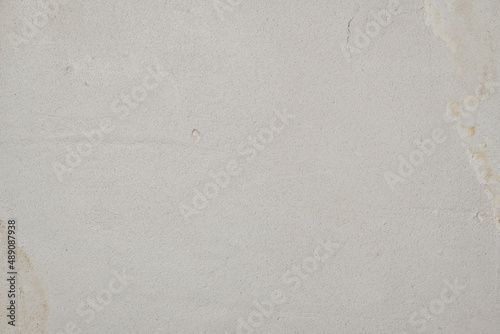Old concrete wall texture. Construction drawing surface. Abstract vintage cracked stones rough, creamy natural color, grunge loft, antique design
