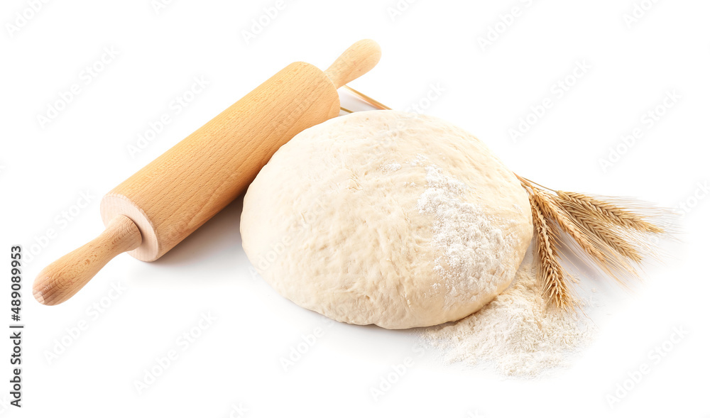 Raw dough with rolling pin on white background Raw dough with rolling pin on white background