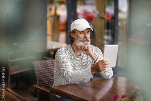 Handsome mature man with ta...