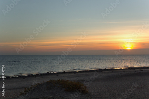 In autumn, during sunset, the clouds partially covered the sun