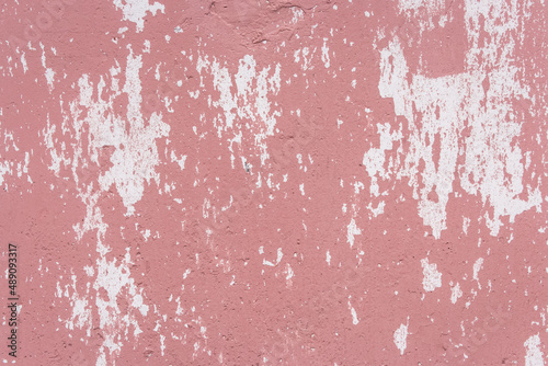 Red peeling paint abstract color pattern design worn weathered white wall surface texture background