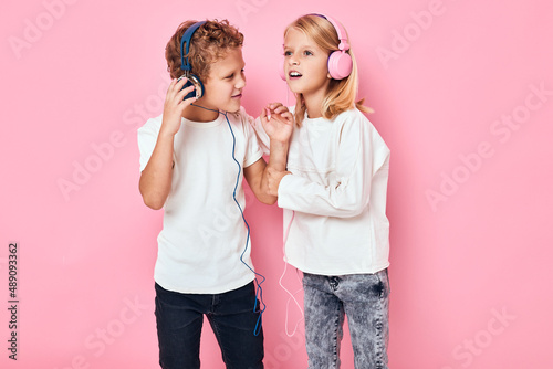 Stylish little boy and cute girl together fun posing lifestyle childhood
