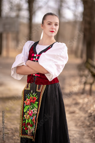 Young beautiful slovak woman in traditional dress. Slovak folklore