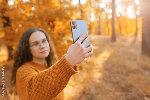 Young woman taking selfie i...