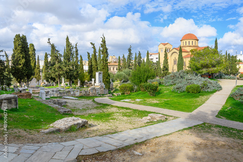 View of the ancient Sacred Way, the road from Athens to Eleusis, and the Aghia Triada Church in the ruins of Kerameikos, the Athenian cemetery, in Athens, Greece. 