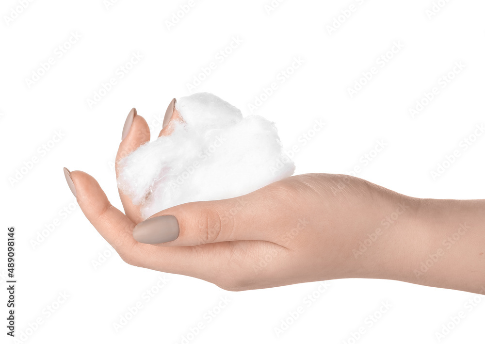 Female hand with clean cotton wool on white background, closeup Female hand with clean cotton wool on white background, closeup