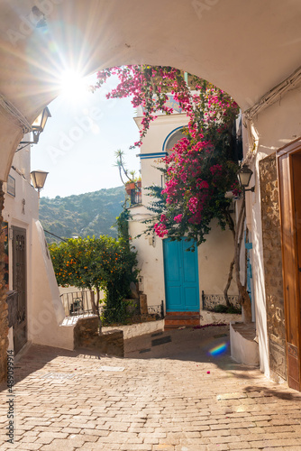 The city gate of Mojacar with white houses on top of the mountain. Costa Blanca in the Mediterranean Sea, Almeria. Spain photo