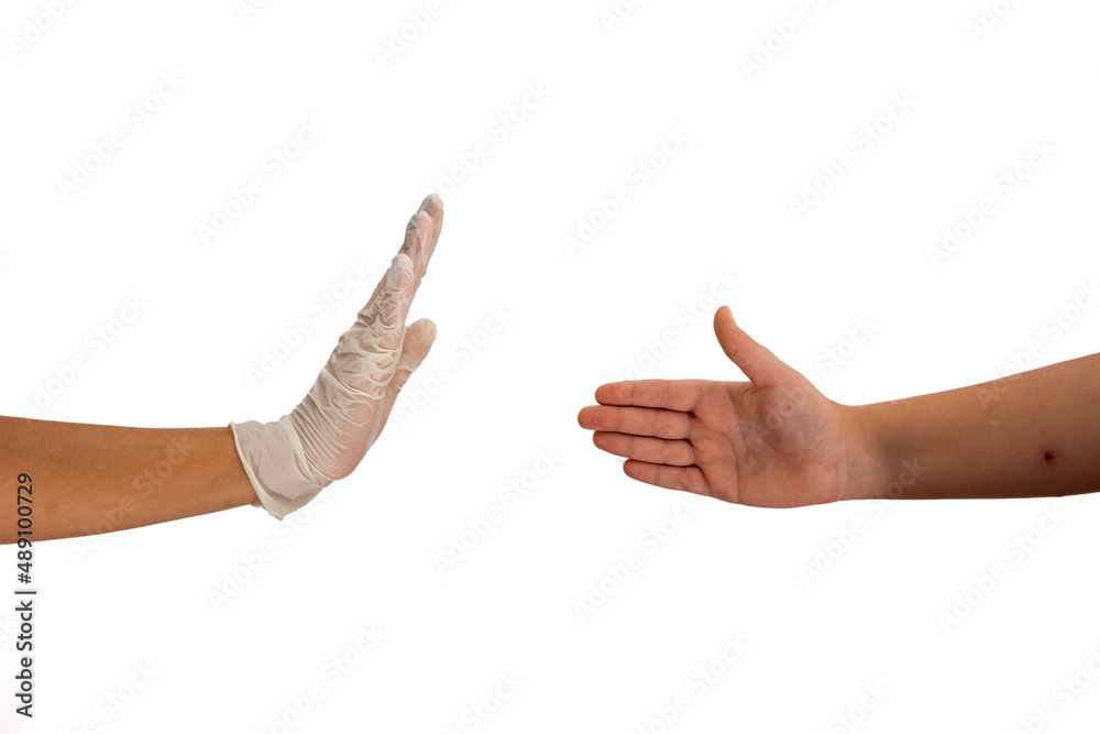 Person wearing gloves avoids shaking hands with non-gloved person and makes a stop sign Person wearing gloves avoids shaking hands with non-gloved person and makes a stop sign