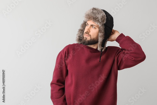 Stylish bearded man in swea...