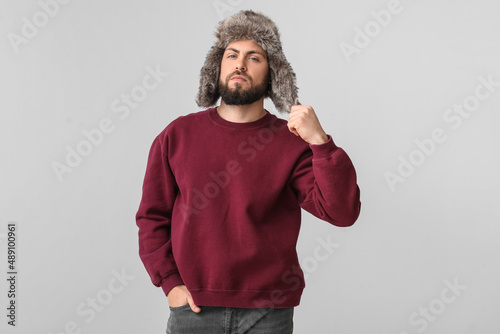 Stylish bearded man in swea...