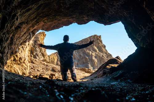 A young tourist in the Almanzora caves, Cala Peñon cut off a virgin and hidden beach in Almería. Mediterranean sea on the coast, Almería