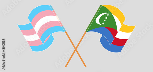 Crossed and waving flags of Transgender Pride and Comoros