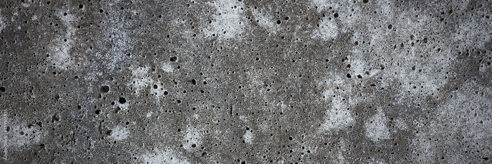 Texture of old concrete wall. Rough, stained concrete surface. Wide panoramic background for design. Texture of old concrete wall. Rough, stained concrete surface. Wide panoramic background for design.