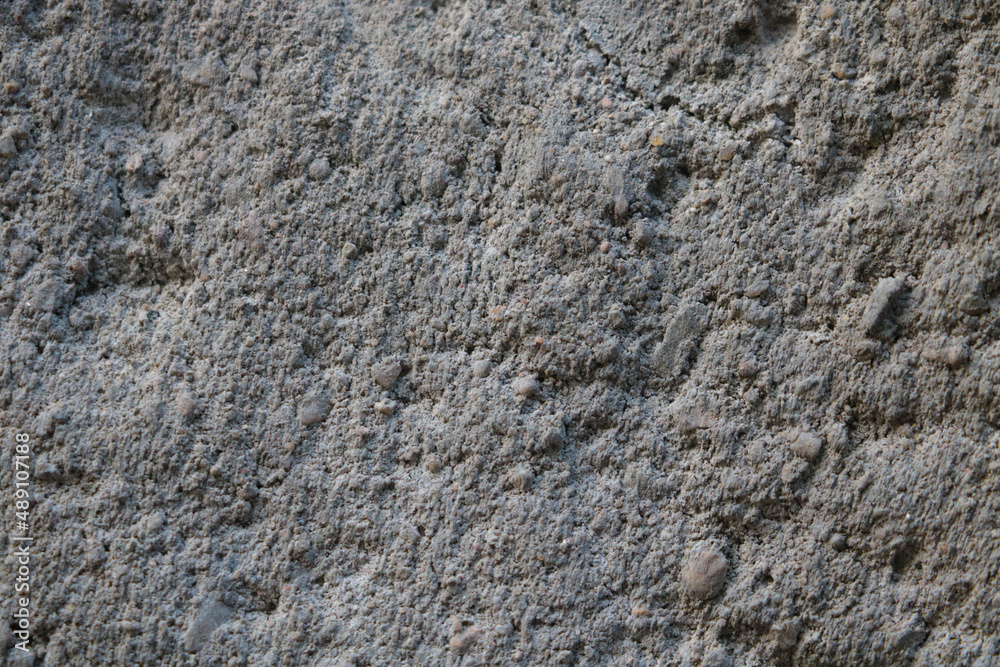 The gray texture of the stone wall of an old building or fence. The gray texture of the stone wall of an old building or fence.