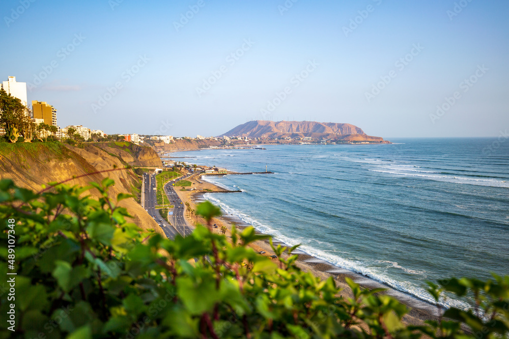 Obraz premium The sun sets over the coast of Lima, Peru in the Miraflores District