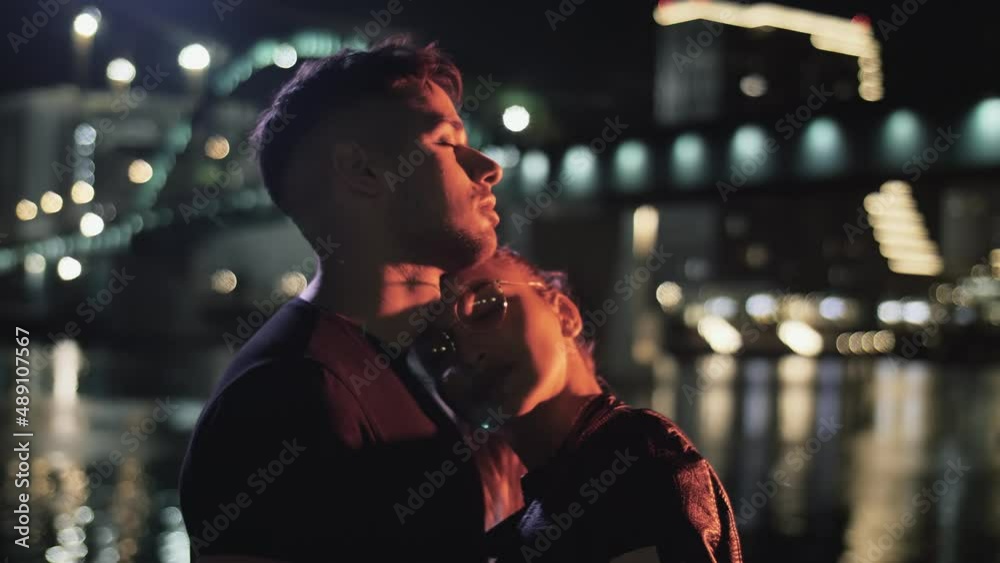 Couple in love hugging on the street at night Couple in love hugging on the street at night
