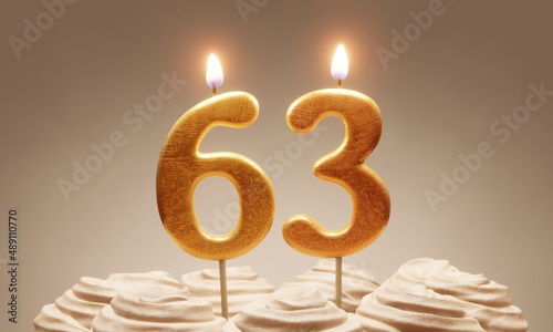 63rd birthday or anniversary celebration. Lit golden number candles on cake with icing in neutral tones. 3D rendering photo