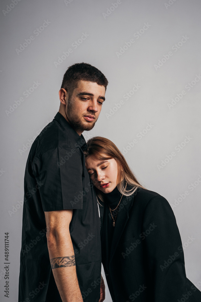 The girl elegantly leaned on the strong body of her man, strong love and trust The girl elegantly leaned on the strong body of her man, strong love and trust