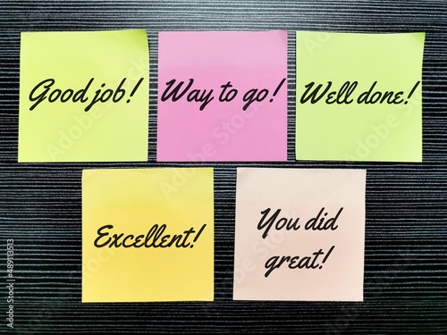 Colorful sticky notes with words of positive praise. photo