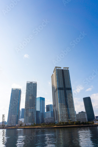 Tower apartments lined up along the river and a refreshing blue sky_19