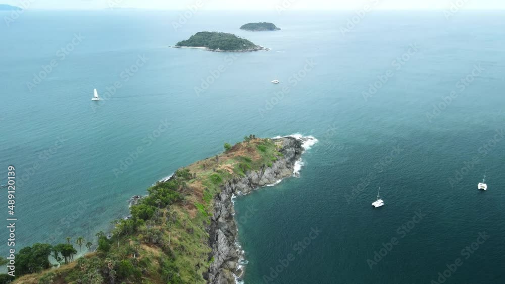 Top view Yachts are sailing and enjoying the view of the sea. Sailing around the island in good weather. Phuket, Thailand. Top view Yachts are sailing and enjoying the view of the sea. Sailing around the island in good weather. Phuket, Thailand.