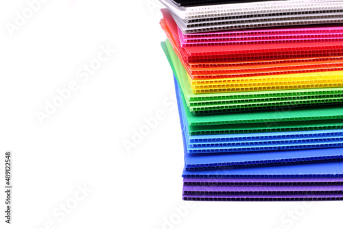 Stack of colorful corrugated plastics isolated on white