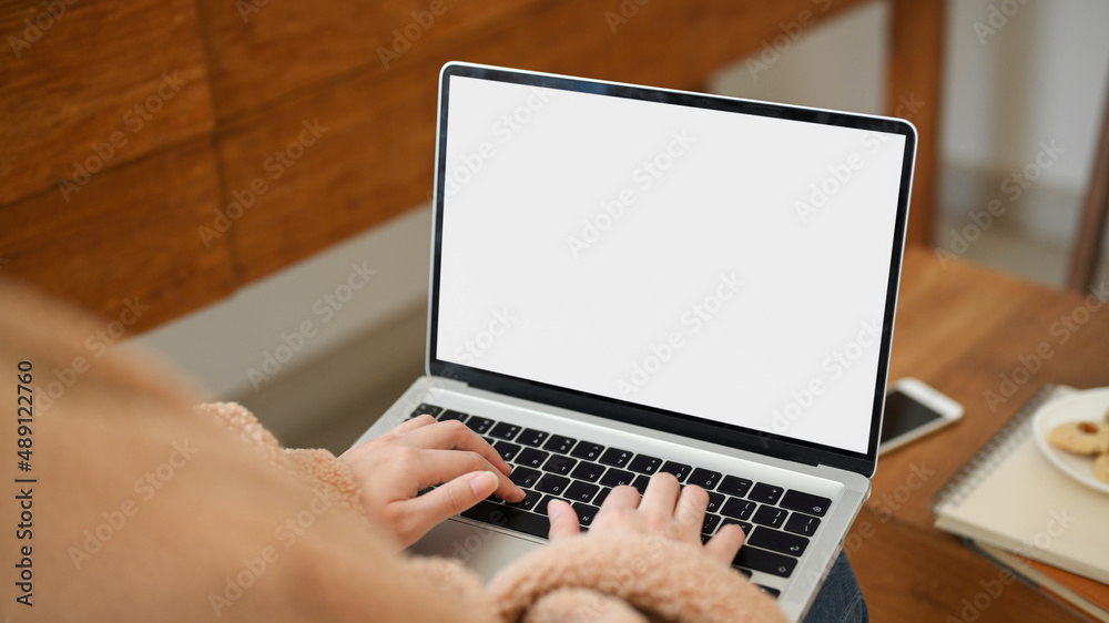 Fototapeta premium Close-up image, A female freelancer remote working at cozy coffee shop