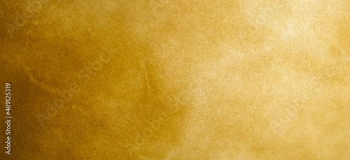 Shiny golden brown backdrop. Abstract background for graphic design, banner, poster.