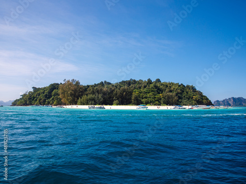 Beautiful view of Ko Phai or Bamboo Island with white sand beach, jungly forest and boats, Krabi Province, Thailand © Lyudmila
