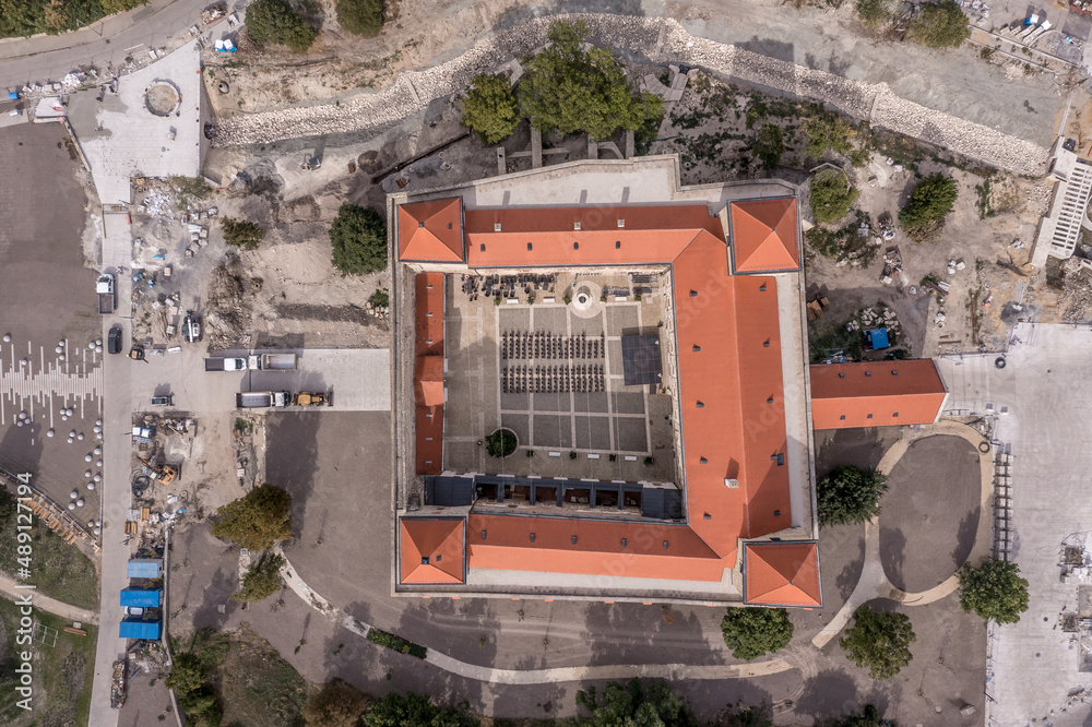 Aerial top down view of Thury castle in Varpalota Hungary with newly  restored red roof, four towers and revived park around Stock Photo | Adobe  Stock