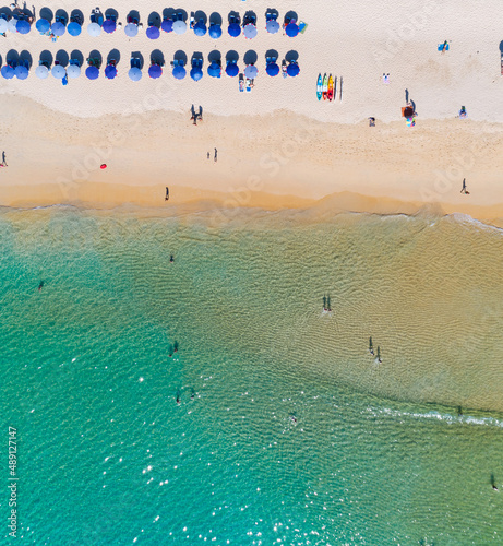 Aerial view Amazing sandy beach and small waves Beautiful tropical sea in the morning summer season image by Aerial view drone shot, high angle view Top down sea beach sand