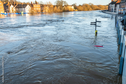 Critically high river waters flowing through Bewdly Bridge,protected by flood defence barriers,Bewdley,Worcestershire,England,UK. photo