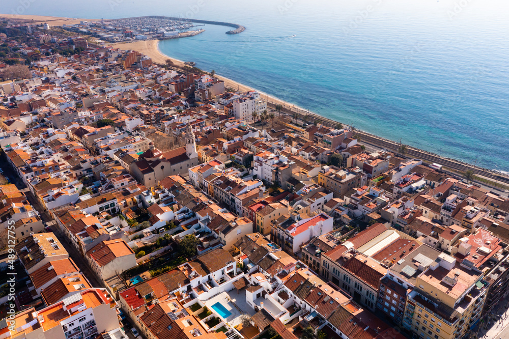 Bird's eye view of coastal town Premia de Mar in comarca of Maresme, Catalonia, Spain. - obrazy, fototapety, plakaty 
