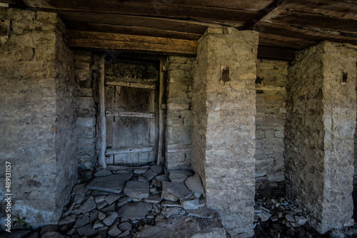 an old locked door in a stone abandoned city