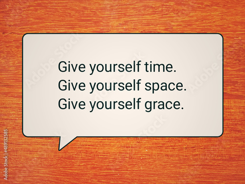 Self love and care motivational words - Give yourself time, give yourself space and grace. With advice sign on orange background. Self priority concept.