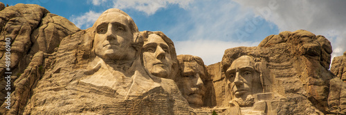 Iconic Mount Rushmore in South Dakota, United States of America. Taken in the summer on blue sky day with close up shot of Presidential faces.  photo