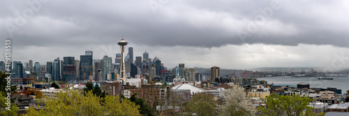The Seattle, Washington skyline seen in spring time with clouds in the background of the city skyscrapers. 