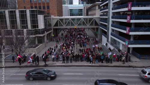 Crowd marching on street flyover bridge closing in Calgary Protest 12th Feb 2022 photo