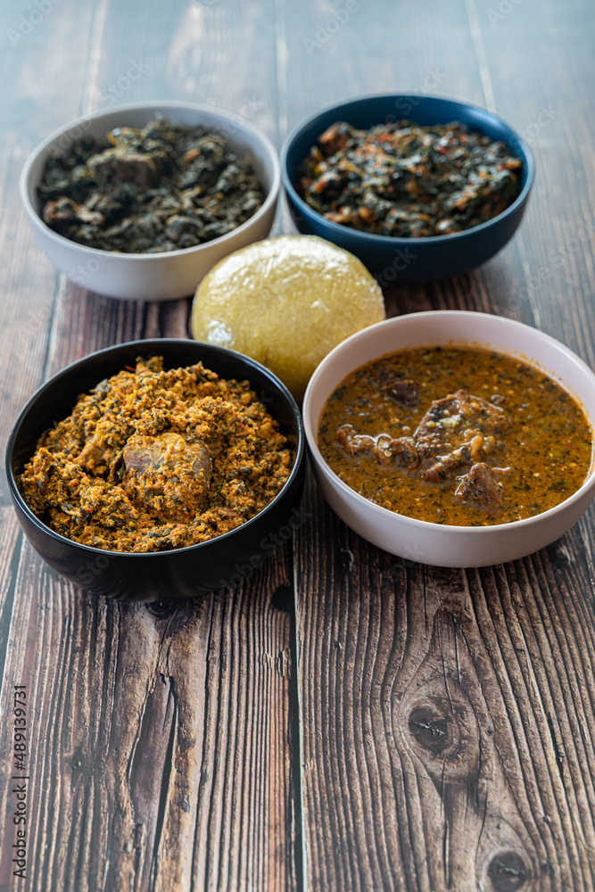 Egusi Ogbonno, Vegetable and Afang soup with pounded yam and Eba Garri