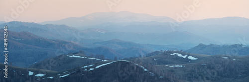 Mountains in spring, sunset light, panoramic view