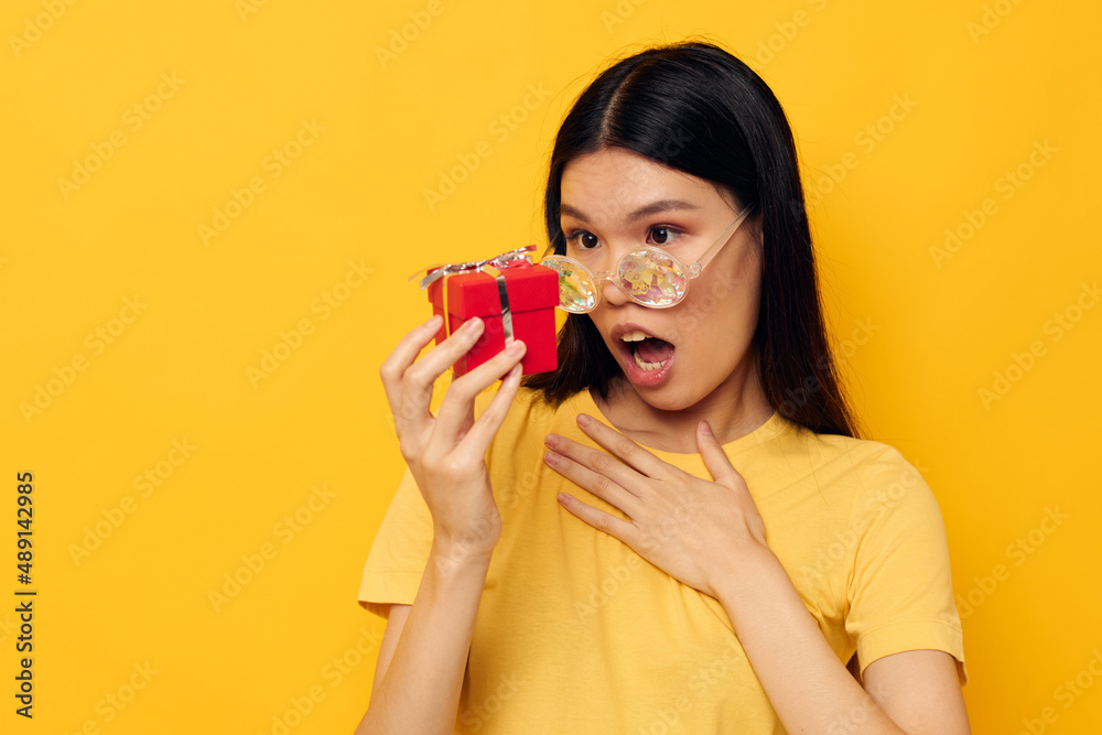 woman with Asian appearance fashion glasses gift holiday close-up studio model unaltered woman with Asian appearance fashion glasses gift holiday close-up studio model unaltered